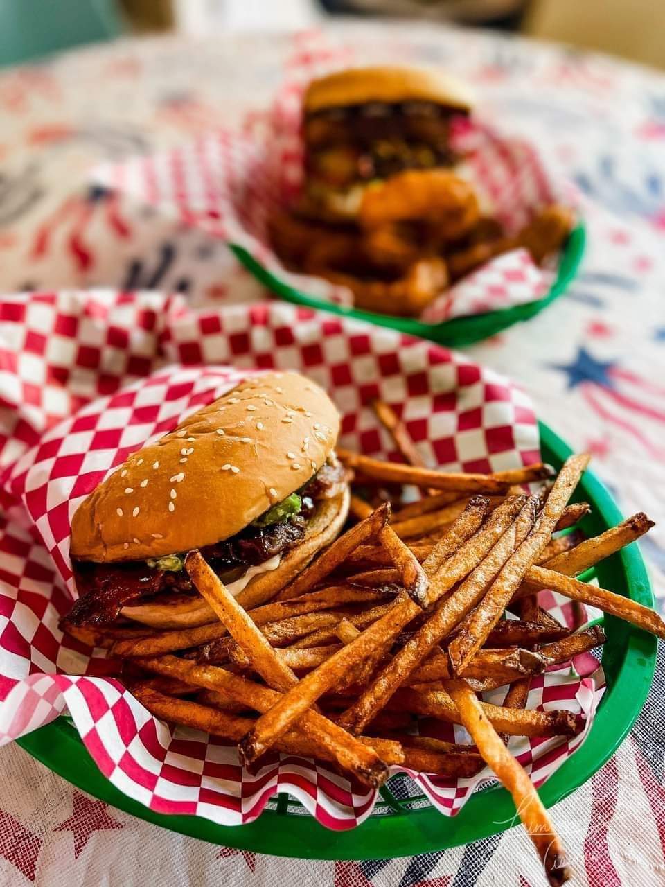Multiple burgers and fries